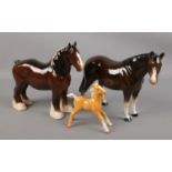 Three porcelain figures of horses. Includes Beswick shire horse, Beswick palomino foal and a Melba