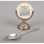 A silver filled desk calendar, assayed for London, 1925, by Henry Williamson Ltd, together with a