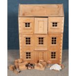 A modern plywood three storey doll's house, complete with a large quantity of doll's house