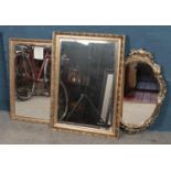 Three gilt framed mirrors. Including bevel edged examples, etc.