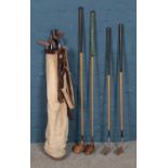 A selection of vintage golf clubs and Spalding canvas bag. To include Wright & Ditson, Spalding