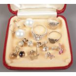 A collection of silver jewellery. Includes seven pairs of earrings and three rings.