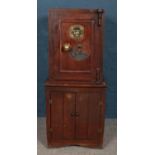 "The Acme" cast iron safe on custom built cupboard. With two keys.