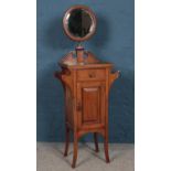 An Edwardian style mahogany inlaid wash stand and bevelled circular mirror. H:141cm W:50.5cm D: 34.