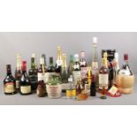 A collection of assorted bottled alcohol. To include Ben Royal whisky 12 years, Martini rose,