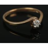 A 9ct gold diamond solitaire ring. Size N. 1.38g.