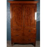 A Victorian mahogany linen press. With beading decoration. (215cm x 135cm x 61cm)