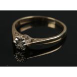 A 9ct gold ring with an illusion set Moissanite stone. Size P. Total weight: 1.89g.