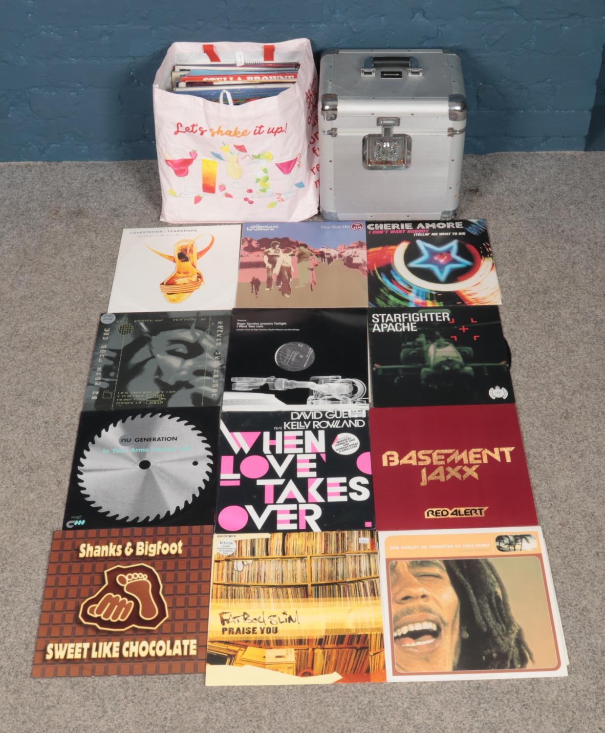 A large heavy duty carry case full of a good collection of dance vinyl records. To include Fatboy