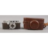 A Leica D.R.P Ernst Leitz Wetzlar camera, with Leitz Elmar f=5cm 1:3,5 lens. In original case.