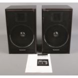 A pair of Technics SB-F44 speakers, with instruction booklet.