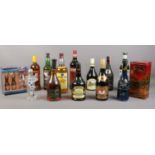 A collection of assorted bottled alcohol. (14) To include Ouzo, Martini, Bardinet brandy, Curacao