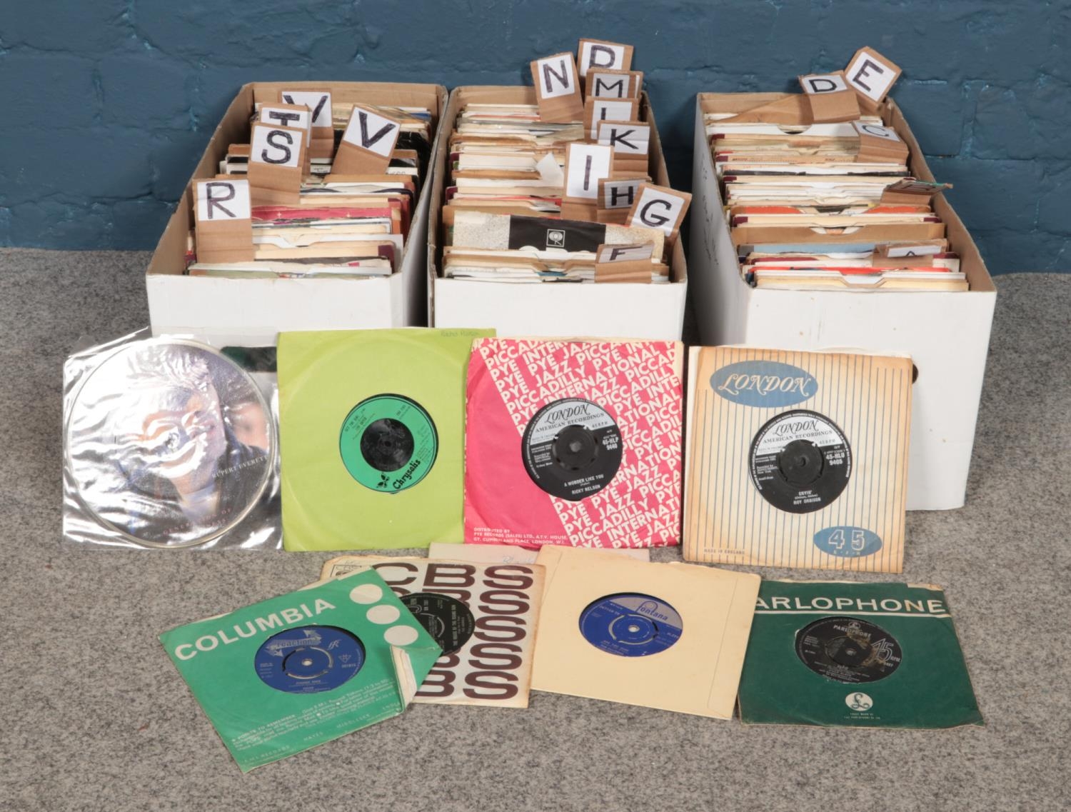 Three boxes of assorted single vinyl 45rpms. Artists to include The Beach Boys, The Seekers, Sam