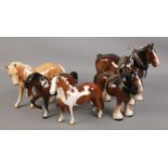 Five porcelain figures of horses. Includes three Beswick examples. Beswick horses with repairs.
