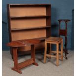 Four pieces of assorted furniture, to include oak stool, drop leaf table and bookcase. One leg