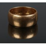 A 18ct gold wedding band. Size X. 14.1g.