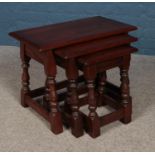 An Old Charm nest of three oak tables.