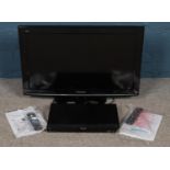 A Panasonic 32" LCD television along with matching DVD player. Both with remotes.
