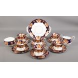 A Royal Albert six part bone china tea set in the Heirloom design.