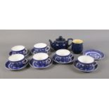 A box of blue and white crockery. To include a small Denby teapot and sugar bowl, and six cups and