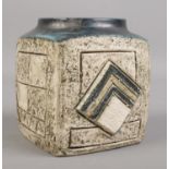 A Troika pottery vase. Each side with textured geometric decoration. 9.5cm height