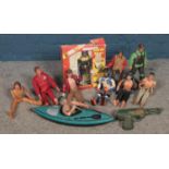 A small collection of Action Man figures, similar figures and props, including canoe and boxed '