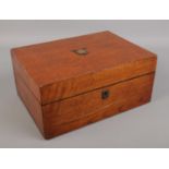 A Victorian oak box with quilted lining.