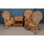 A trio of bamboo and weave conservatory chairs, together with a bamboo side table with single