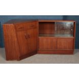 Two pieces of vintage teak furniture, to include G Plan corner secretaire and similar sliding
