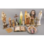 A large collection of religious items, including crucifix, Jesus bust and Lord's Prayer display.