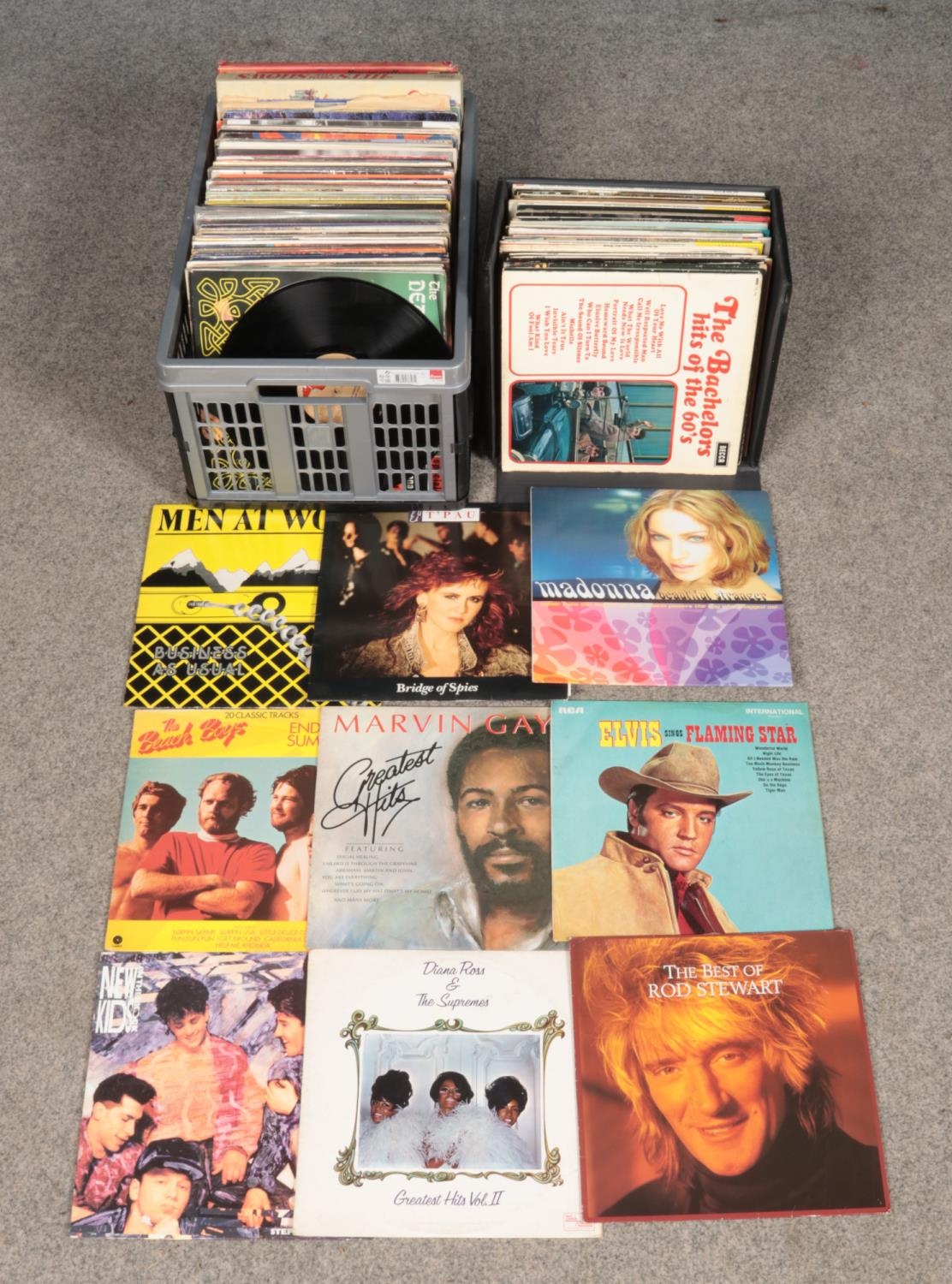 A carry case and large box of mostly rock and pop records. To include Rod Stewart, Madonna, Men at