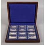 A cased set of twelve silver ingots depicting 'Palaces of Great Britain', each individually