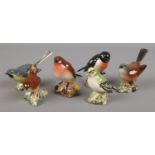 Six porcelain Beswick bird figures. Including Whitethroat, Stonechat, Robin etc.