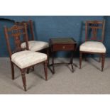 Three Victorian mahogany chairs, with spindle back, carved splat and turned front feet, together