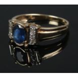 An Art Deco style 9ct sapphire and diamond ring. Size N ½, Total weight: 3.05g.