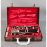 A cased four-piece Boosey & Hawkes Edgware clarinet, with extra reeds.