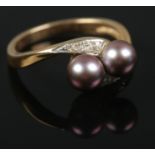 A 9ct gold cultured pearl and diamond ring. Size P. 3.39g.