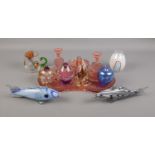 An assortment of glassware. To include a Langham glass dump and paperweight, glass Murano style fish