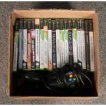 A collection of Xbox games, including Fifa Street, Halo and Need for Speed, together with three