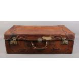 A large vintage brown leather suitcase, with canvas lining and small letter pouch. Height: 23cm,