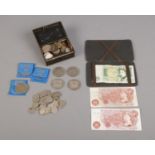 A collection of UK coinage and notes. To include two 10 Shilling notes, a one pound note, two