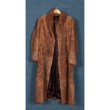 A ladies fur coat. Length: 121cm, Inside Arm: 41cm.