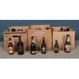 A collection of assorted vintage bottled alcohol. To include Vintage Budweiser, Bass, McEwan's,