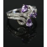 A 9ct white gold diamond and amethyst ring. Size L. 2.78g.