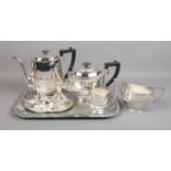 A Sheffield made EPNS part tea and cruet set on tray. To include a tea and coffee pot etc. Dent to