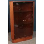 A glass fronted teak corner display unit, with two internal glass shelves. Height: 128cm, Width: