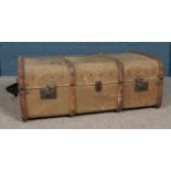 A wood bound canvas trunk, with pull out interior. Height: 34cm, Width: 86cm, Depth: 53cm.