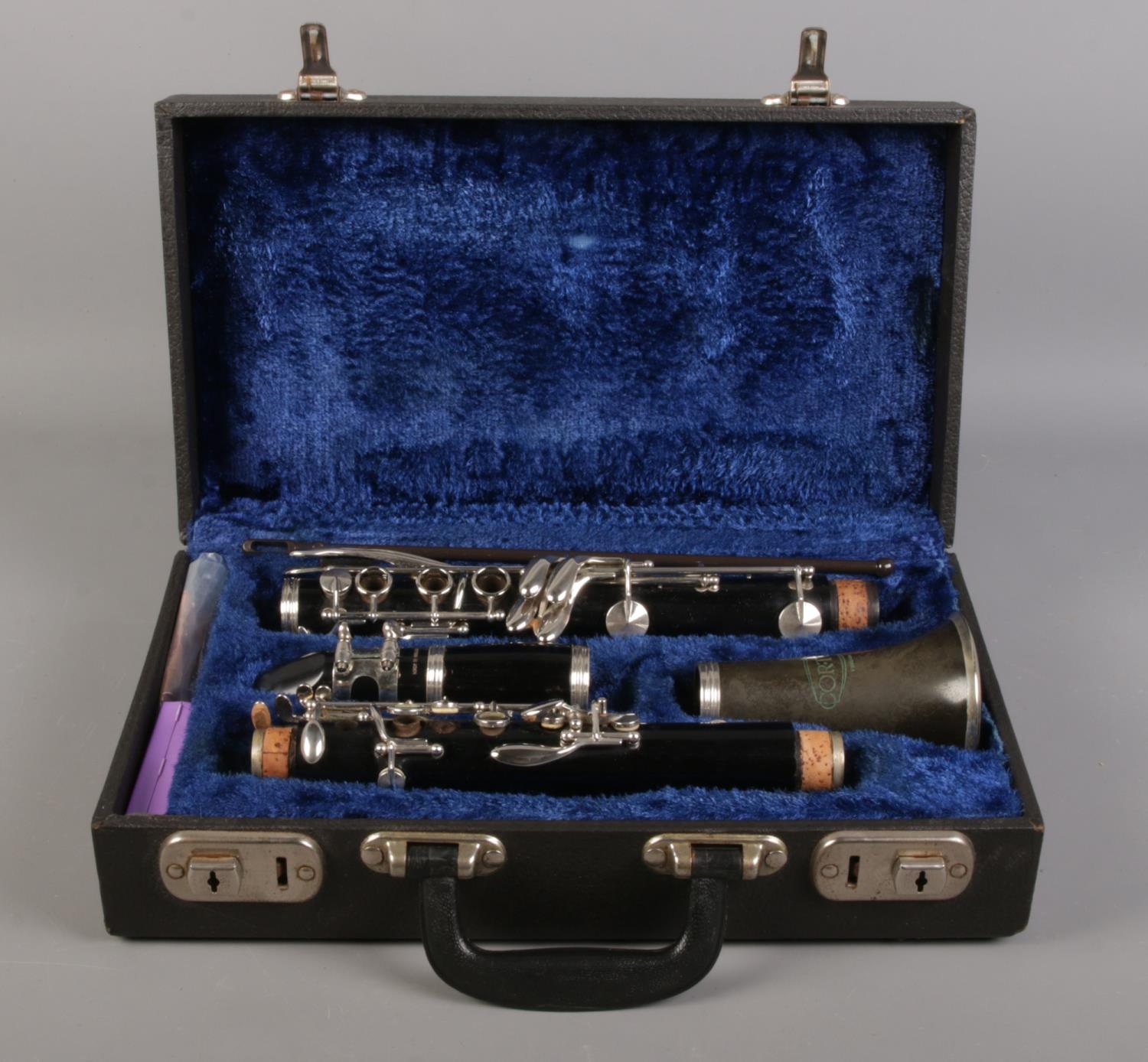 A cased Corton clarinet, with Calteau mouthpiece and accessories.