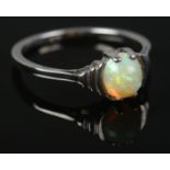 A 9ct white gold Art Deco style ring set with a single opal. Size M. 1.8g.