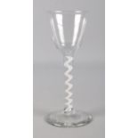 An 18th century wine glass with opaque air twist stem. 15.5cm.